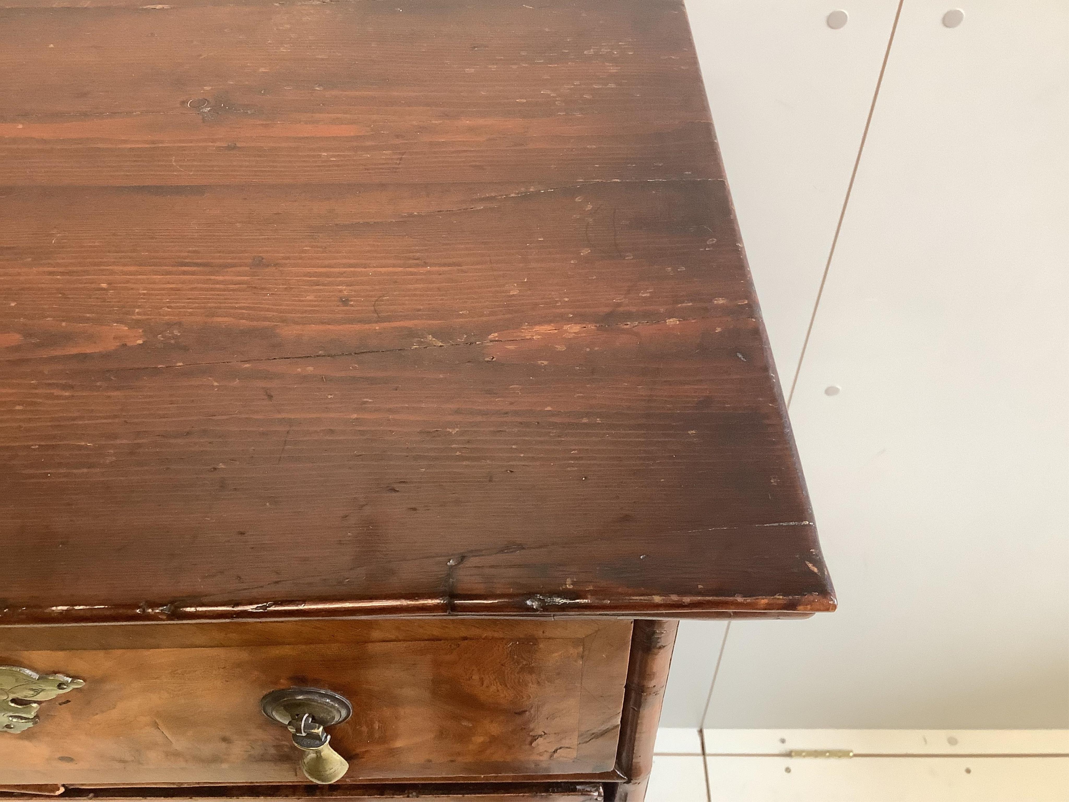 An early 18th century walnut chest on stand, width 98cm, depth 53cm, height 148cm. Condition - fair to good